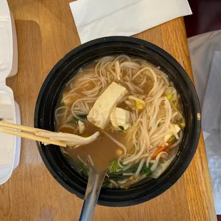 Very thin chicken slices and Not fried tofu in bland broth. Chicken combo that I had to add Hoisin, sriracha, and hot chili sauce into.