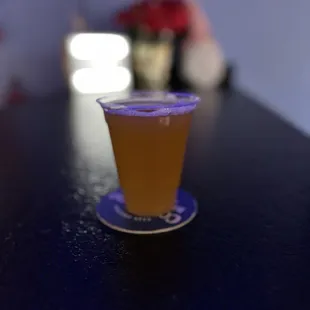 a shot of a drink on a table