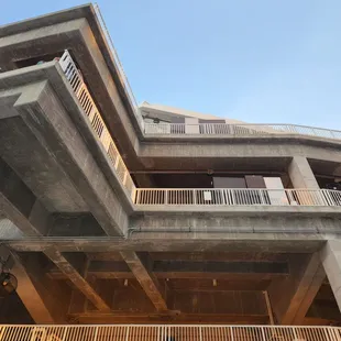 a concrete building with balconies