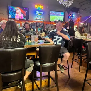 a group of people sitting at a table