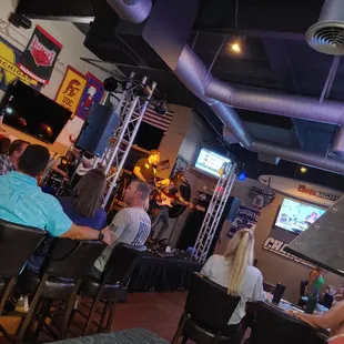 a crowd of people sitting at tables