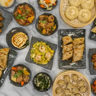 Shrimp fried rice, dumplings, buns, rougamo, Chinese cheese pancakes, leek pocket, beef wraps, fried fish, vegetables, soup, and much more!