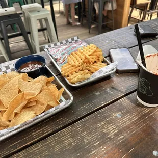 Chips and queso, smash burger, and prickly pear margarita