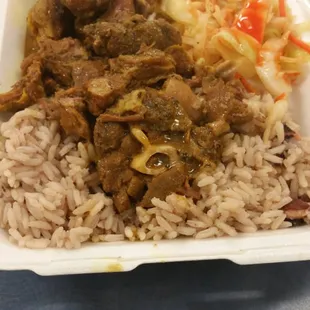 a tray of rice and meat