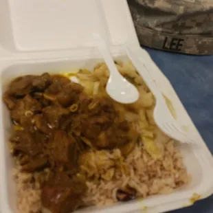 Curry goat, cabbage, and beans and rice