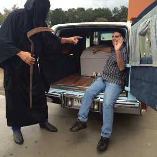a man sitting in the back of a truck