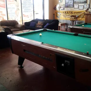 2 pool tables and sofas