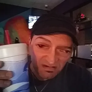 a man holding a cup of coffee