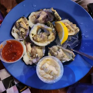 a plate of raw oysters