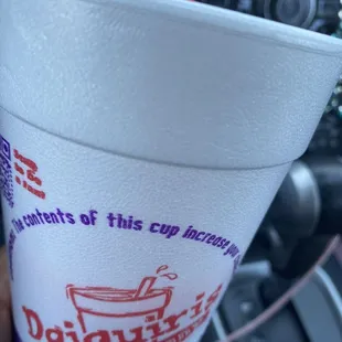 a cup with a drink in it