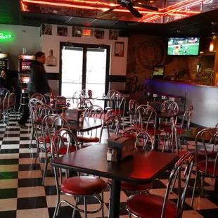 a restaurant with a checkered floor