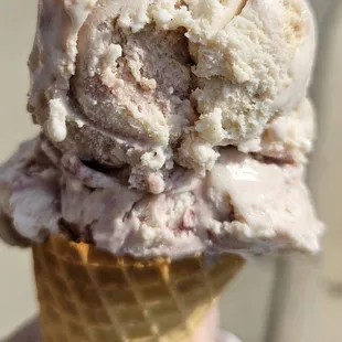 Southern blackberry cobbler ice cream on a waffle cone