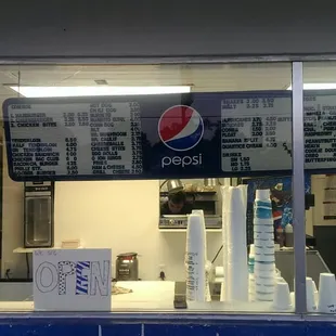 a pepsi sign in the window