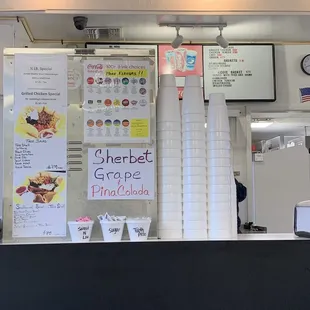 menus and signs on the counter