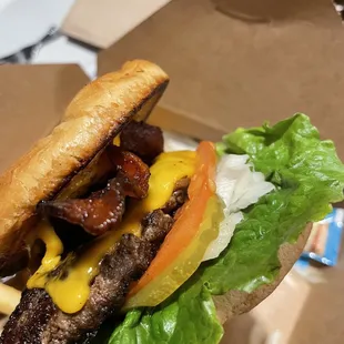 Bacon Cheese Burger with veggies and Mayo packets on the side