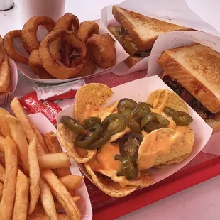 Western burgers, fries, beer battered onion rings, and nachos.