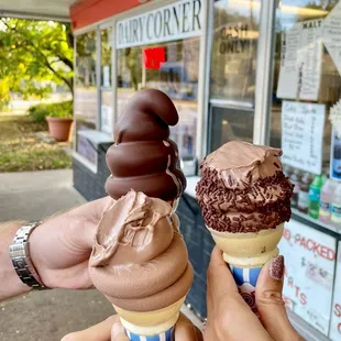 two ice cream cones with chocolate frosting