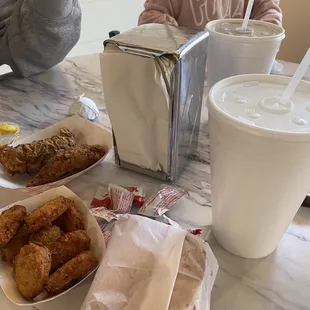 Two large cokes and three food items came out to 27$.