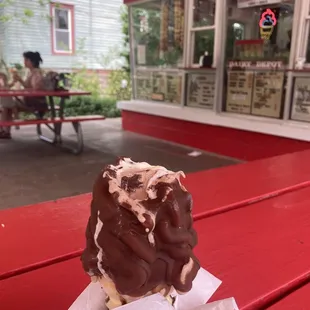 Medium cone w chocolate dip less than $4.