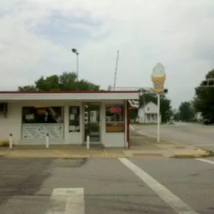 a dairy store on the corner of a street