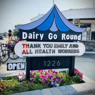 ows a sign for dairy go round
