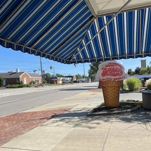 an ice cream cone on a sidewalk