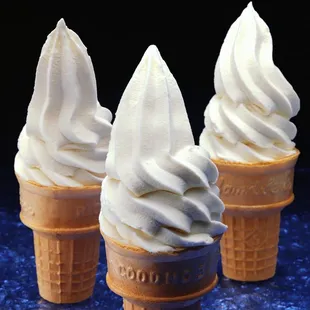 three ice cream cones with whipped topping