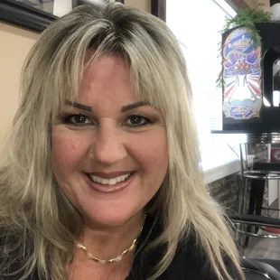 a woman smiling in a restaurant