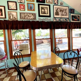 a dining room with a table and chairs