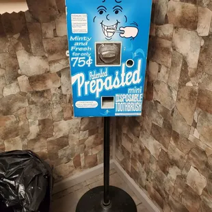 Toothbrush machine in the women's bathroom