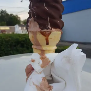 Good ice cream, wrong way to dip a cone.