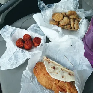 Top right: Fried Pickles. Left: Tater Kegs. Bottom, busting out of the flour tortilla, is the flounder taco.