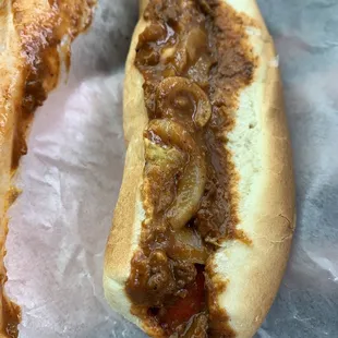 Hotdog with mustard chilli and onions