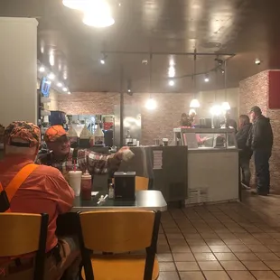 people sitting at a table in a restaurant