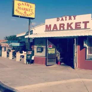 a dairy market on the corner of a street