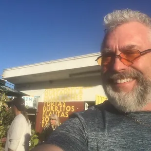 The front of both the Dairy market AND the restaurant with it's ad board outside.