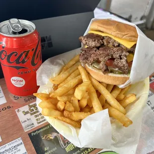 a burger and french fries on a table