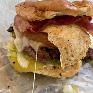 The House burger! Bacon, egg, onion ring, pepper jack cheese. Winner!