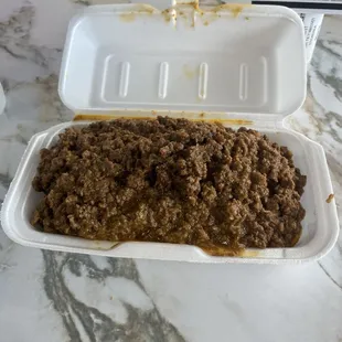 Burrito covered in ground beef
