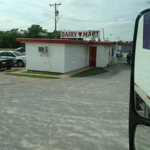 a car parked in front of a dairy mart