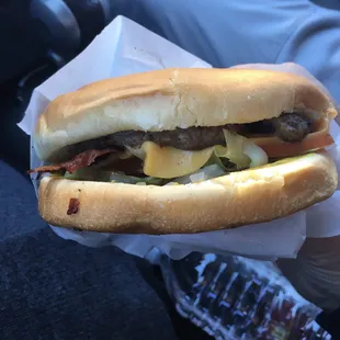 Oh my, oh my! Old fashioned bacon cheeseburger with Mayo and mustard, chopped onions, melted American cheese, sliced tomatoes, lettuce.