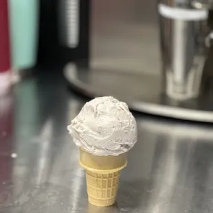 a cone of ice cream on a counter