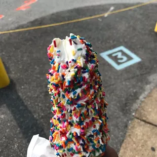 an ice cream cone with sprinkles