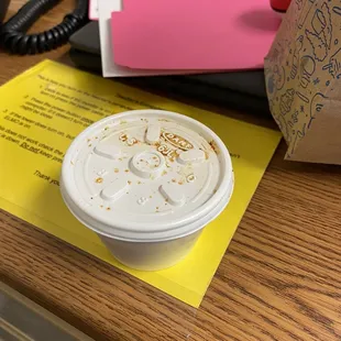 Refrigerated gravy covered in some sort of filth.