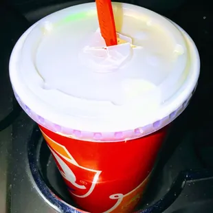 a plastic cup with a straw sticking out of it