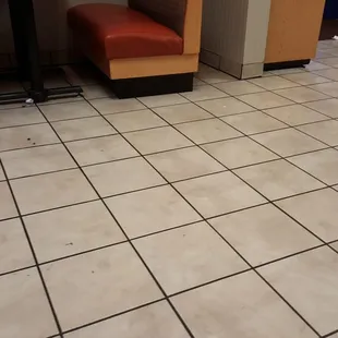 Floor next to our table and the trash bins were over flowing with trash!