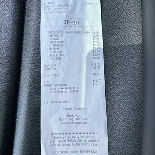 a receipt in the passenger seat of a car