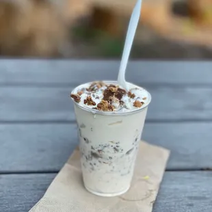a cup of yogurt on a napkin