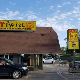 a car parked in front of a restaurant