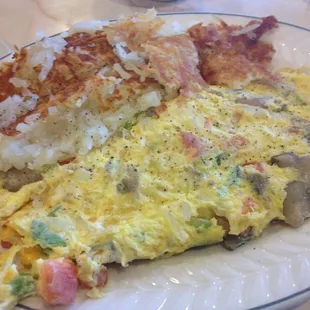 Mushroom omelette with white toast and hash browns.